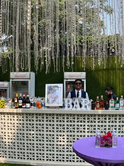 Our full bar setup for an elegant Haldi ceremony, complete with a custom menu and our professional team ready to serve. The crystal hangings add a touch of glamour.
