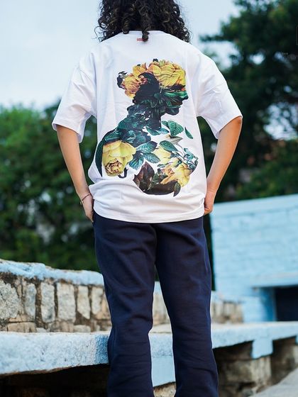 This Godsake tee features a beautiful floral silhouette graphic on the back. It’s a more artistic take on streetwear, printed on a clean white oversized shirt.