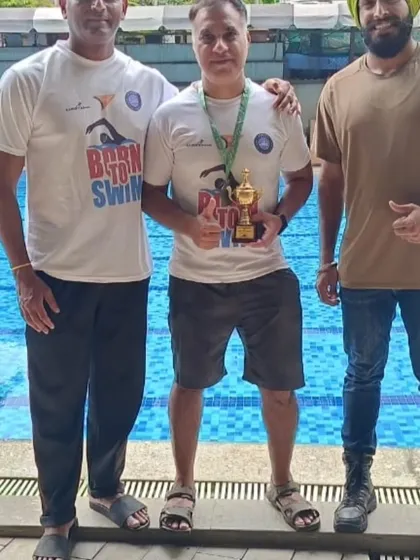 Standing proud with a winning swimmer. My role as a coach is to guide and support, but it is the athlete who puts in the work. This trophy represents a partnership built on trust and a shared goal.