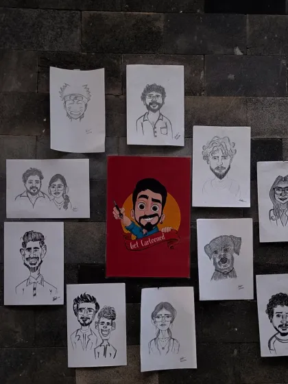 This is a glimpse of my art wall, showcasing a variety of hand-drawn caricatures. You can see solo portraits, couples, families, and even a pet sketch, all created with pencil and paper to capture each unique story.
