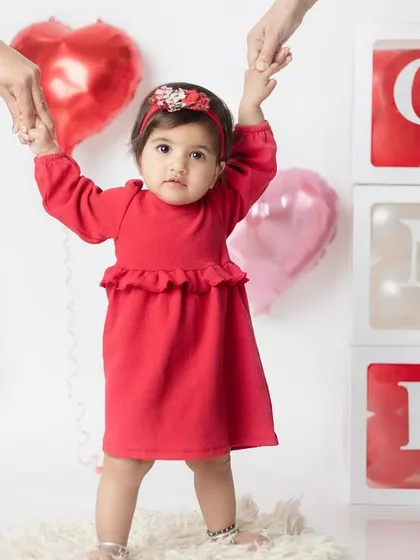 Taking her very first steps into year one! I love capturing these huge milestones during a first birthday photoshoot.