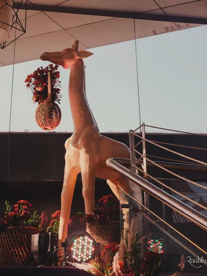 A life-sized giraffe statue was a quirky and fun element we added to the entrance decor.