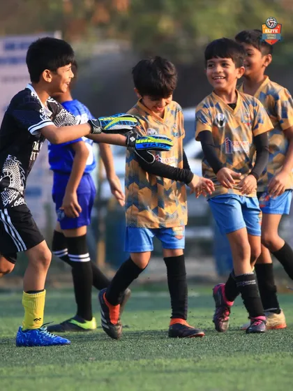 A moment of sportsmanship and camaraderie between teammates after a successful play.