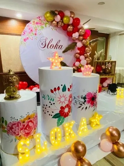 A different angle of the beautiful floral-themed setup, highlighting the custom backdrop.