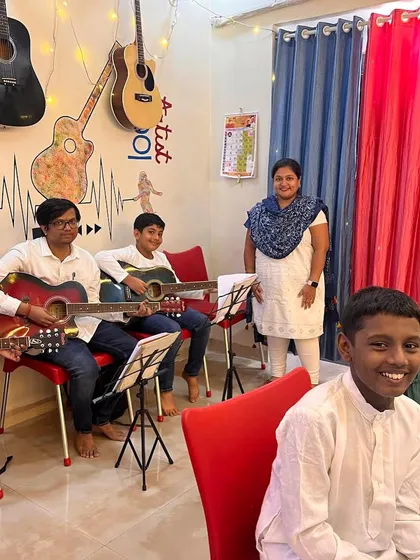 Students preparing for a small performance at our academy. We provide many opportunities like this for our learners to showcase their skills on the guitar and build stage confidence.