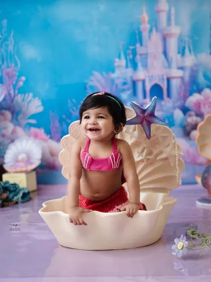 The happiest little mermaid in her enchanted undersea kingdom. My studio is filled with whimsical props and backdrops to create magical fantasy worlds where your child's imagination can run wild.