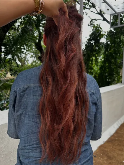 Holiday hair with a twist. This gorgeous reddish-copper color is perfect for making a statement on your next vacay. It’s warm, vibrant, and full of life.
