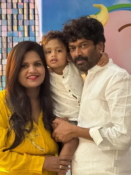 A beautiful family portrait taken at the Cocomelon party, a memory they can cherish forever.