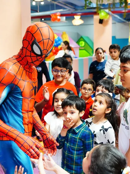 The children gather around, captivated by Spider-Man's arrival. Our character appearances are designed to create a sense of awe and excitement for all the guests.