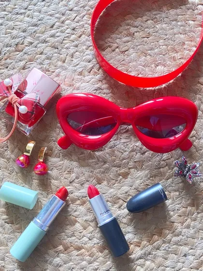 A collection of my favorite red accessories for the season. From sunglasses and lipstick to earrings and nail polish, adding a pop of red is the quickest way to make any outfit feel more vibrant and confident.