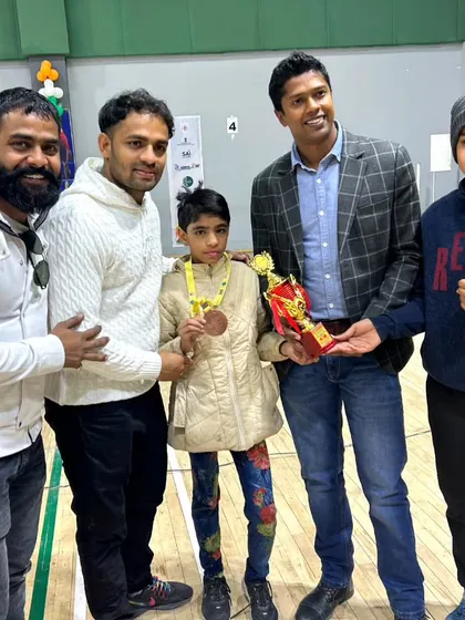 Celebrating a victory with my student and her trophy at the Khelo India North Zone league. We are a team, and every individual win is a victory for the entire academy.