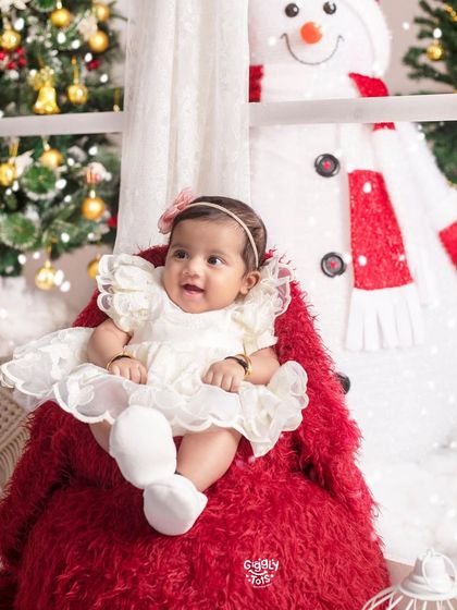 What more could I ask for Christmas? This sweet baby girl, looking like a little snow angel, is the greatest gift of all.