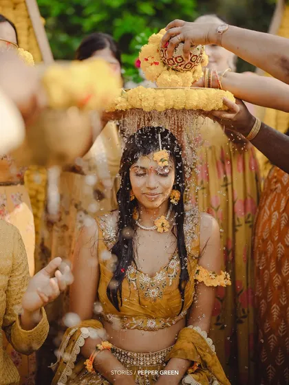 The vibrant Haldi ceremony, where Medhus is showered with flowers and blessings. I focus on capturing the rich colors and textures of Indian wedding traditions to make your film visually stunning.