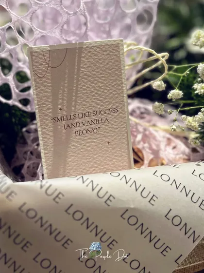 The smallest details carry the biggest meaning. A custom note reading "Smells like success (and vanilla peony)" adds a touch of personality and wit to a brand launch gift, showing how I infuse every element with the client's unique story.