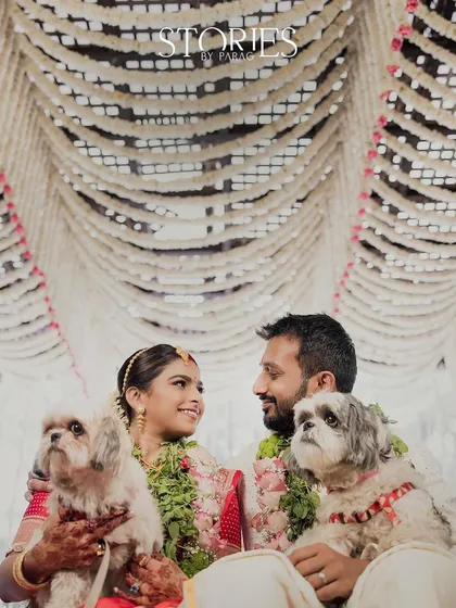 A wedding is about the whole family, including the furry members. This heartwarming portrait from a South Indian wedding, with the couple and their beloved dogs, is a perfect example of a truly personal and memorable moment.