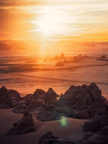 Is this a drone or camera shot? It was captured from a hot air balloon at sunrise in AlUla, Saudi Arabia. The view over the ancient site of Hegra was absolutely surreal.