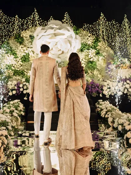 The reception is a celebration of your new beginning, and the entrance should be nothing short of spectacular. I capture you walking into your future, surrounded by a cascade of light and florals, with every detail reflecting the grandeur and elegance of the occasion.