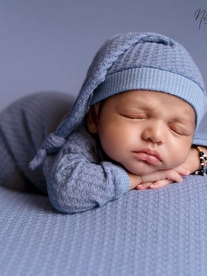 That little pout is just everything. I focus on capturing these fleeting expressions and tiny details, like the bracelet on his wrist, that make your baby unique.