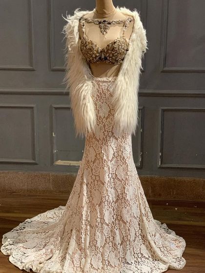 New in! This ivory lace lehenga with a stunningly embellished bustier and a faux fur shrug is a high-fashion, celebrity-style look.