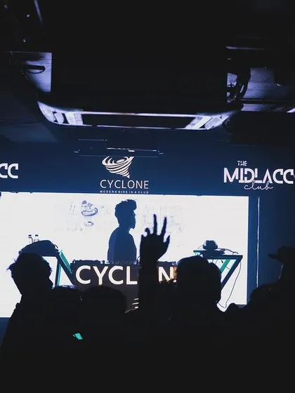 A silhouette of me against the club's screen at The Midlacc Club, Cyclone.