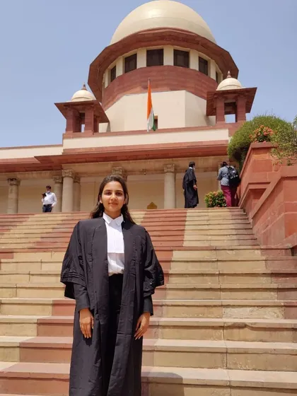 Posing on the steps of the Supreme Court of India. Practicing here requires a deep understanding of law and procedure, which I bring to every case I handle.