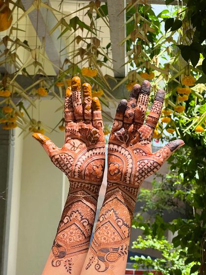 A beautiful semi-bridal design with a rich stain, perfect for NRI brides or those who want an intricate look with less coverage.