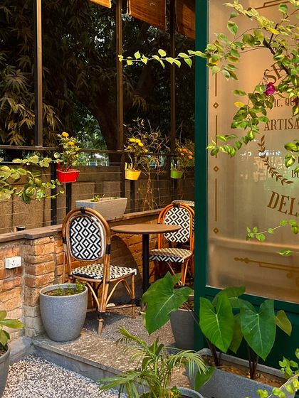 A charming little corner in my outdoor garden area, perfect for an intimate meal or a quiet cup of coffee.