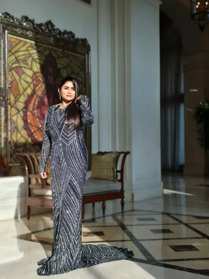 A full-length view of my elegant attire for the SolutionX Summit, showing how I blend glamour with corporate sophistication.
