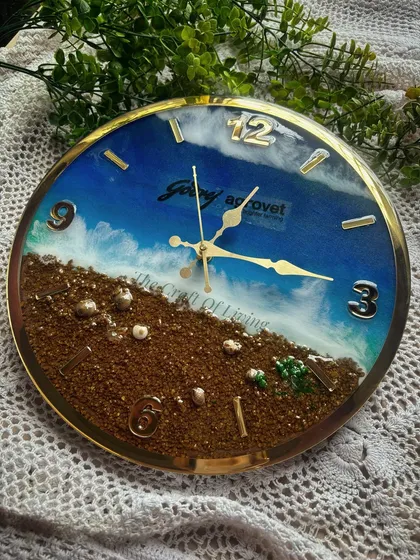 This is the custom wall clock I created for Godrej Agrovet. It features a stunning ocean wave effect made with resin, with the company's animal feed product preserved along the "shore." The company logo is elegantly placed in the center.