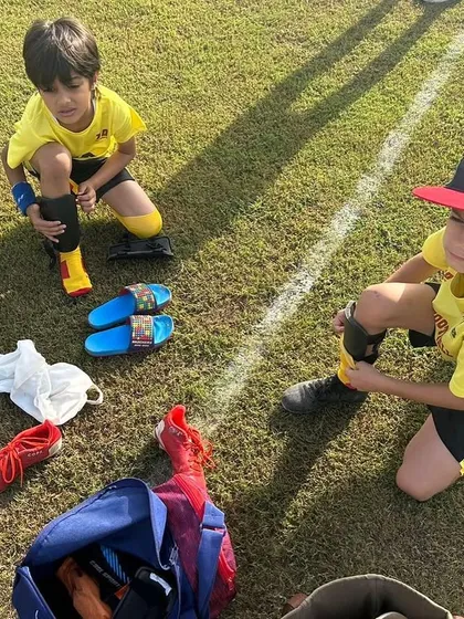 Two young players getting ready for a match. It's about the journey of growth and the exhilaration of the game.