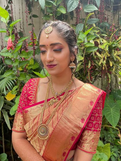 Another angle of this stunning engagement look, showing how the makeup complements the natural green backdrop.