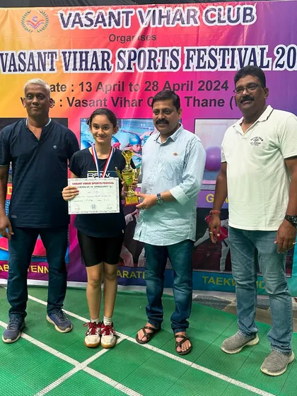 Girls U-13 winner Sharvi Kothekar with her championship trophy.