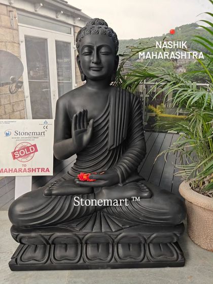The 3-foot black marble Abhaya Mudra Buddha statue displayed in our showroom. Its elegant posture and striking color make it a powerful piece for any interior or exterior setting.