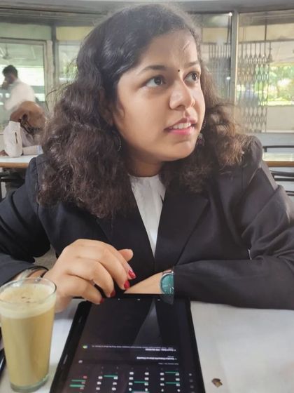 The life of a lawyer often involves working between hearings. Here I am in a court premises canteen, using my tablet and a coffee to keep the momentum going.