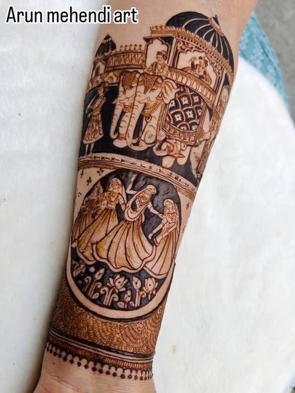 A forearm design showing a doli procession with elephants and dancing figures.