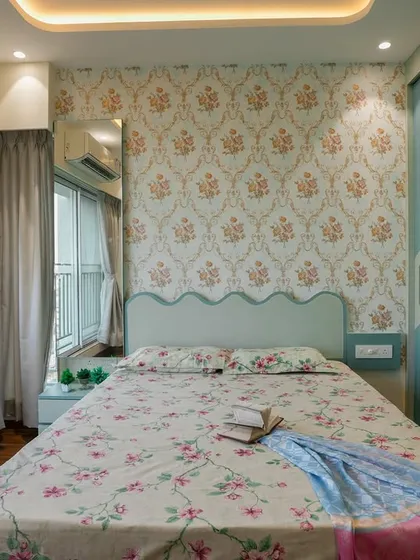 A view of this bedroom from the balcony door, showing the ample natural light.