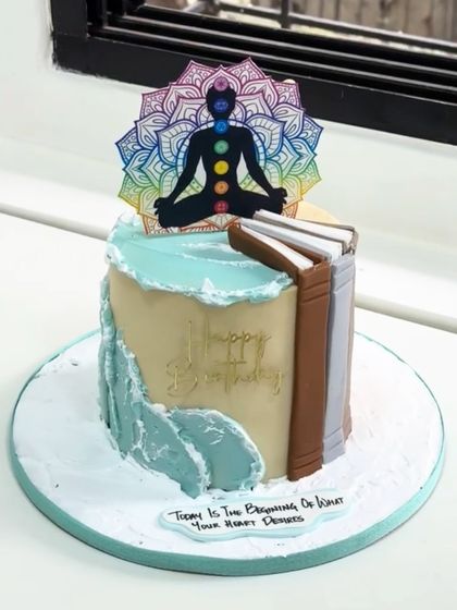 A cake that reflects peace, knowledge, and new beginnings. This unique design combines the harmony of chakra balance with the wisdom of books for a truly spiritual celebration.