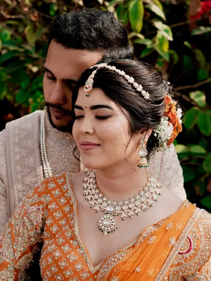 A romantic close-up of the bride and groom. Reeya's copper-hued eyes and fresh skin look stunning next to her partner.
