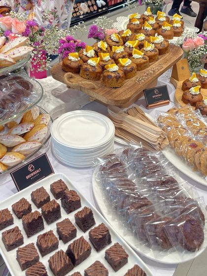 Another shot of our dessert table, showing individually wrapped cookies and brownies for easy and hygienic serving at corporate events. We also provide eco-friendly plates and cutlery.