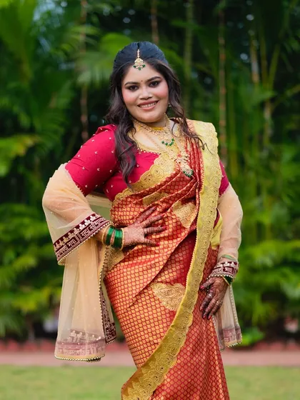 The full look, showcasing the beautiful saree and soft open curls. A perfect blend of tradition and modern styling.
