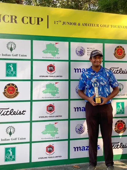 Raunik Kharkwal proudly poses with his trophy at the NCR Cup.