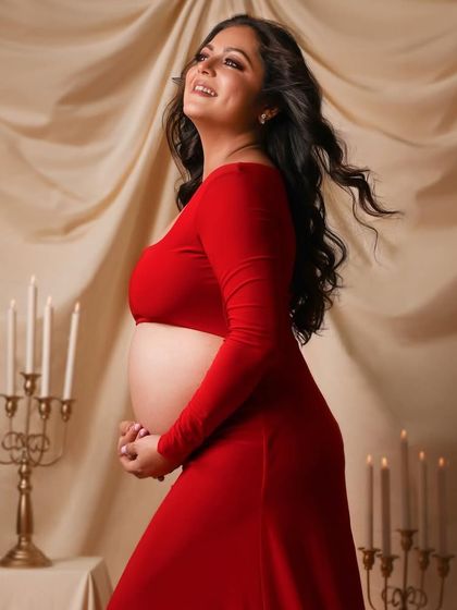 A joyful, candid moment with her hair caught in motion, adding life and energy to the portrait.