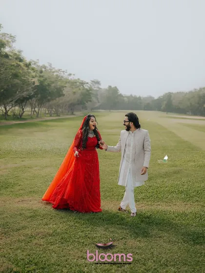 Another stunning photo of the happy couple. The groom's classic sherwani and hairstyle were designed to complement the beautiful outdoor setting.