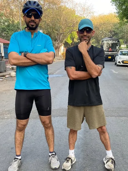 Two cyclists posing with attitude. We ride with style.
