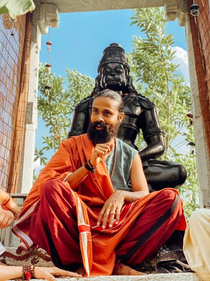 I sit before a statue of Hanuman, the embodiment of devotion and service. Our philosophy talks often take place in these sacred spots around the ashram, drawing inspiration from the environment.