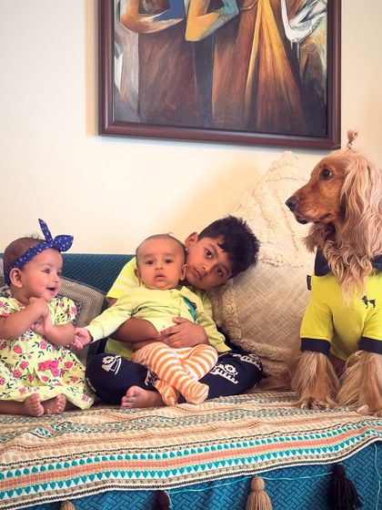 Posto looking over the little ones. He truly is the guardian of the family's youngest members.