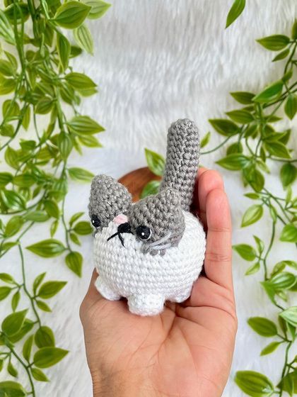 A grumpy but cute little cat plushie. I love his expressive face! This was a custom order to replicate a customer's pet, and I'm so happy with how he turned out.