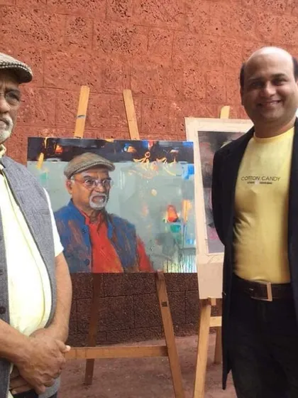 Standing beside my completed portrait of Raosaheb Gurav Sir, a tribute to a great artist.