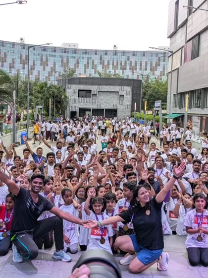 The energy of our community is everything. This is a snapshot from our "Run for Happiness" marathon warm-up, where hundreds of people came together at dawn to move, sweat, and prepare for a run that supports great causes.