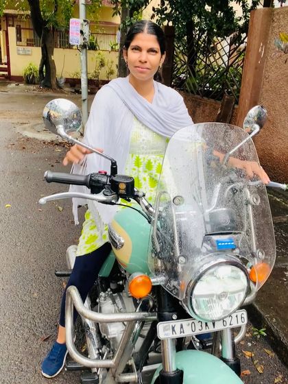 A graduate looking poised and proud on her Royal Enfield. This is the confidence that comes from mastering a new skill and breaking stereotypes.